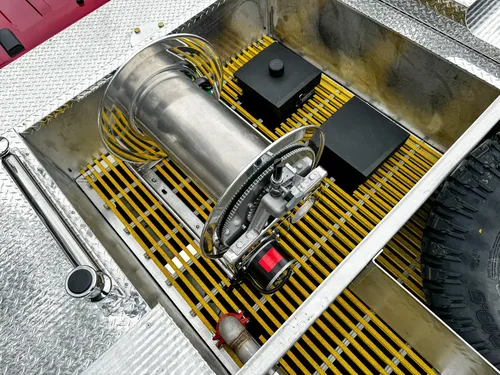 Top rear platform view showing side rails and open grating bay.